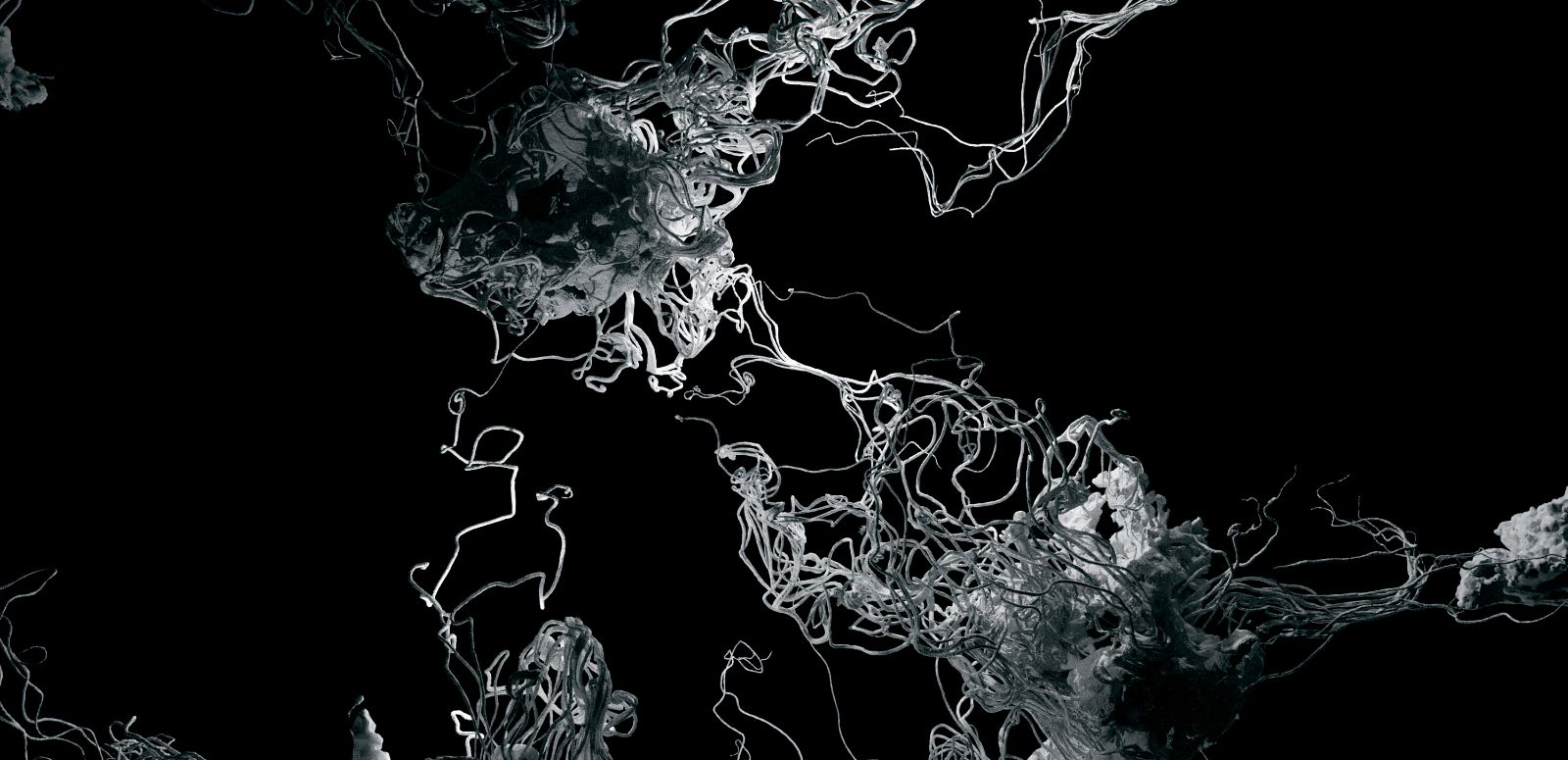 Clusters of threads move across the image area, emerging from lump-like formations.